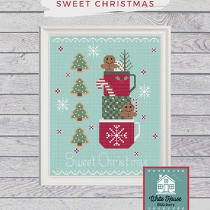 May include: Cross-stitch art with a Christmas theme. The design features stacked red mugs filled with gingerbread men, candy canes, and small Christmas trees. The words "Sweet Christmas" are displayed above and below the mugs.