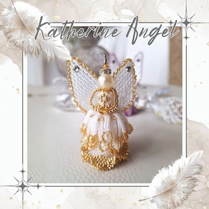 May include: A handmade angel figurine with white and gold beadwork. The angel features beaded wings, a pearl head, and a gold halo. The text "Katherine Angel" is written above the angel.