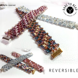 May include: Three reversible beaded bracelets with silver and gold clasps. The bracelets are made with a variety of colors, including pink, purple, blue, and white. The bracelets are arranged in a cross pattern on a white surface. The text "REVERSIBLE" is printed in black at the bottom of the image.