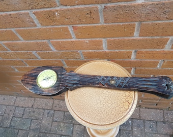 Vintage barometer in a wooden spoon shape