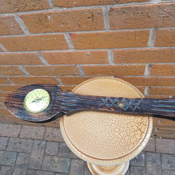 Vintage barometer in a wooden spoon shape