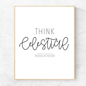 May include: A framed print with the words "THINK celestial" in black script. Below the words is the name "RUSSELL M. NELSON". The print has a white background and a light brown frame. The overall theme is inspirational.