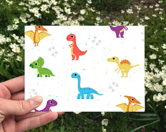 May include: A white card with a repeating pattern of colorful cartoon dinosaurs. The dinosaurs are in various poses and include a green triceratops, a blue brachiosaurus, a purple stegosaurus, an orange pterodactyl, a red tyrannosaurus rex, and a yellow velociraptor.