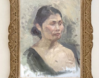 May include: A framed oil painting of a woman with dark hair and a black dress. The woman is looking to the right of the frame. The painting is in a simple, ornate frame.