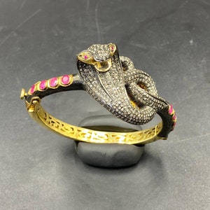 Beautifull snake shape genuine rose cut diamond with natural ruby and Sterling silver with gold plated bangle