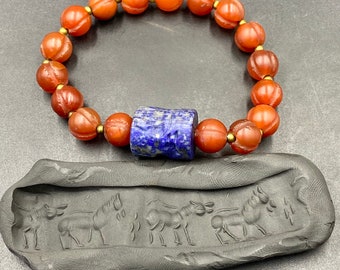 Ancient old antique lapis lazuli stone intaglio cylinder seal with carved carnelian bead bracelet