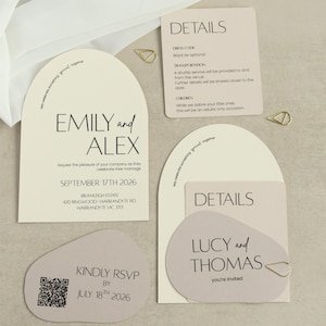 May include: A set of wedding stationery featuring arched and organic-shaped cards in cream and soft mauve. The cards display black text including names like Emily and Alex, Lucy and Thomas, event dates, venue details, and a QR code for RSVP.
