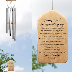 May include: A wooden wind chime with a beige tag that reads "To my Dad On my wedding day You are my coach, my mentor, my role model, and my friend. I am who I am today because of you. I hope each time you hear this wind chime you will remember just how grateful I am for the impact you have made on me. Today I'm a bride, tomorrow I'm a wife, but I will always be your little girl. Love, Jennifer 08-13-22"
