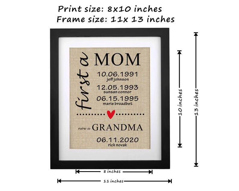 May include: Framed print with a black border. The print, 8x10 inches, features the words "first a MOM" and "now a GRANDMA" in black text. Dates and names are listed below, with a red heart. The frame measures 11x13 inches.