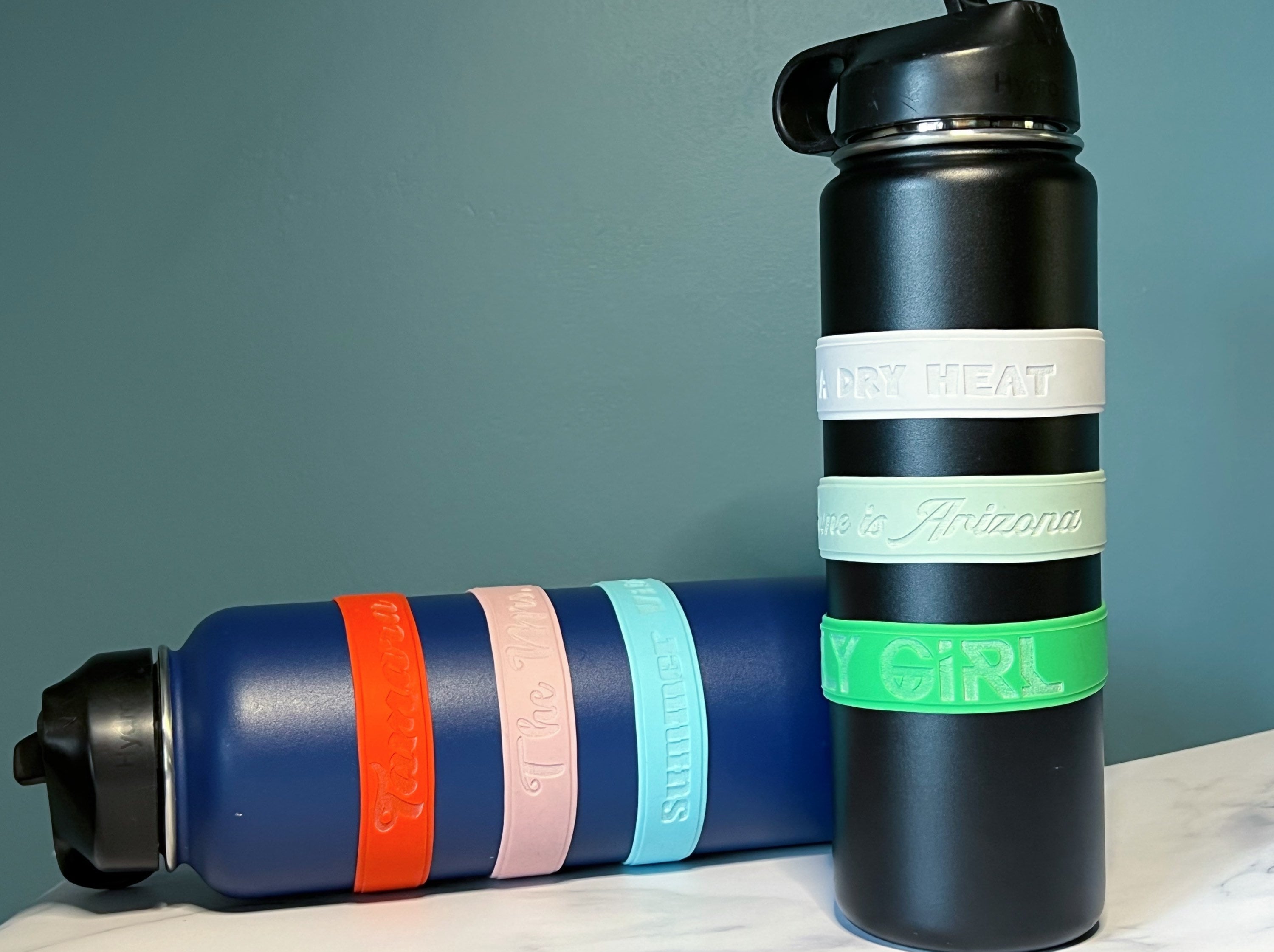 Black GiveGrip™ Silicone Water Bottle Sleeve compatible with 17oz