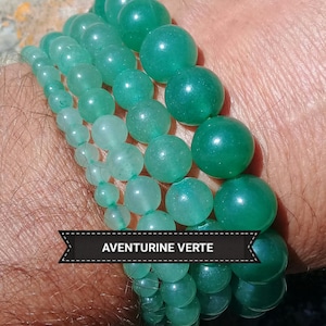 May include: A stack of four green aventurine bracelets with the text "AVENTURINE VERTE" on a black label.