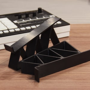 Universal stand with rise 50mm. For small and medium synthesizers or groovboxes.