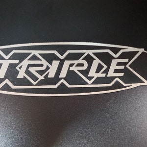 Peavey TRIPLE X logo on silver