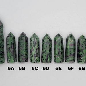 May include: Nine green and black gemstone points, labeled 8B, 6A, 6B, 6C, 6D, 6E, 6F, 6G, and 6H.