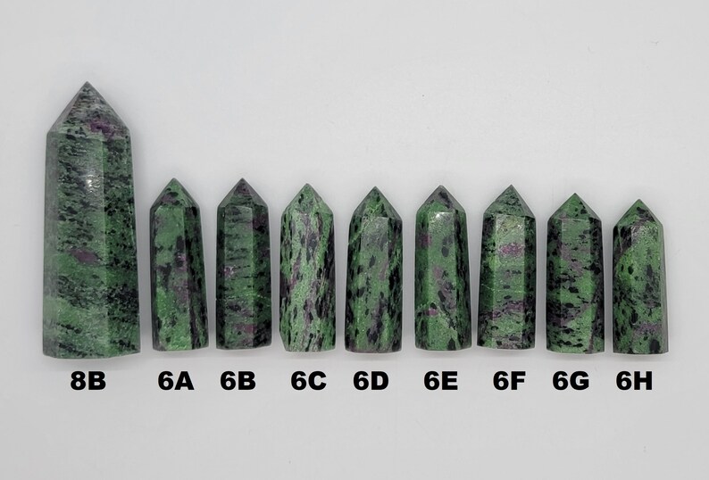 May include: Nine green and black gemstone points, labeled 8B, 6A, 6B, 6C, 6D, 6E, 6F, 6G, and 6H.