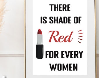 Puede incluir: Una impresión enmarcada blanca con texto negro que dice "There is shade of Red for every women". Un lápiz labial rojo está ilustrado al lado del texto.