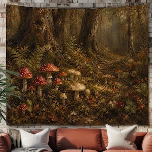 May include: A rectangular wall tapestry featuring a detailed forest scene with large trees, ferns, and a cluster of red and white spotted mushrooms on the forest floor. The artwork displays a dark, earthy colour palette of brown, green, and red.