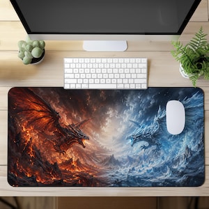 May include: A rectangular desk mat featuring a high-contrast fantasy illustration of a fire dragon on the left and an ice dragon on the right. The fire dragon is surrounded by molten lava and dark volcanic rock, while the ice dragon is set against a backdrop of jagged, snow-covered mountains and frozen terrain.