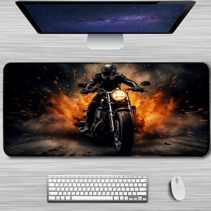 May include: A black motorcycle with a rider in a black leather jacket and helmet, speeding through a fiery orange and black smoke trail.