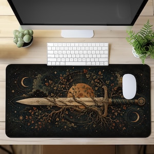 May include: A rectangular desk mat featuring a dark, celestial-themed illustration of a horizontal sword entwined with tree branches and autumn leaves, set against a backdrop of a large orange moon, crescent moons, and scattered stars.