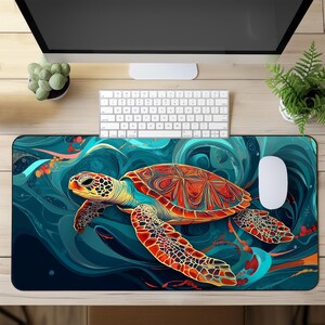 May include: A colourful abstract design mouse mat featuring a sea turtle swimming through swirling blue and green waves. The turtle has a red, orange and yellow shell with intricate details.