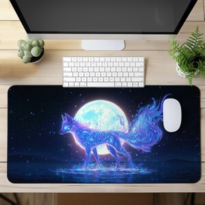 May include: A blue and purple fox with a glowing tail and a full moon in the background. The fox is standing on a dark blue surface with stars in the background. The mouse pad is designed for use with a computer.