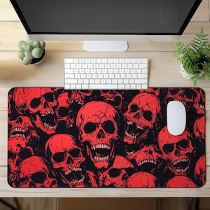 May include: Red skull pattern mousepad with a black background. The skulls are in a repeating pattern and have a detailed design.