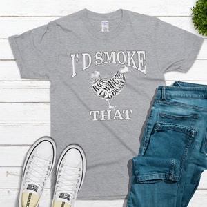 May include: A gray t-shirt with the text "I'd Smoke That" and a chicken silhouette with the different parts of the chicken labeled.