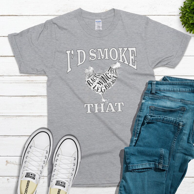 May include: A gray t-shirt with the text "I'd Smoke That" and a chicken silhouette with the different parts of the chicken labeled.
