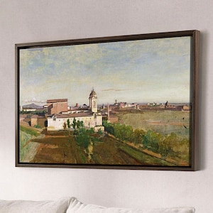 May include: A living room with a beige sofa, two brown armchairs, and a coffee table. The sofa has two white pillows and two patterned pillows. A framed painting of a cityscape hangs on the wall above the sofa. A lamp with an orange shade is on the right side of the image.