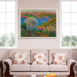 May include: A framed painting of a landscape with a river, trees, and hills. The painting is done in a pointillist style with bright colors, including pink, blue, green, and yellow.