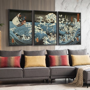 May include: Three framed Japanese woodblock prints depicting a scene of a ship caught in a large wave with a figure on the ship, a scene of a large wave with a figure in the wave, and a scene of a large wave with a figure in the wave.