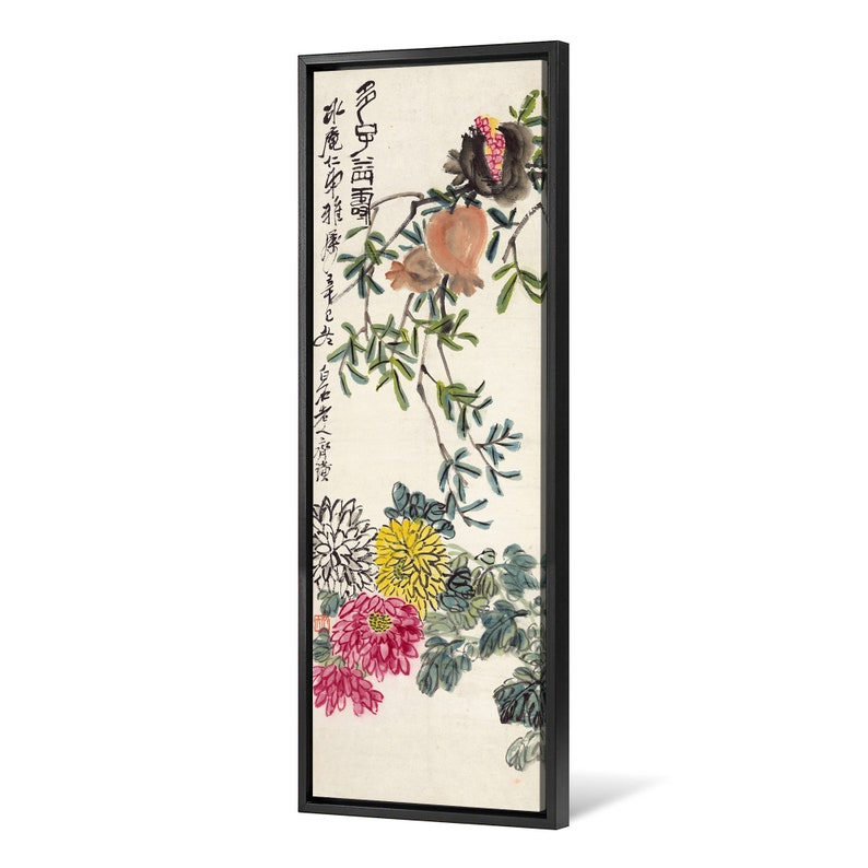 May include: A vertical painting of a branch with green leaves, pink and yellow chrysanthemums, and red pomegranates. The painting is framed in black and has Chinese calligraphy in black ink.