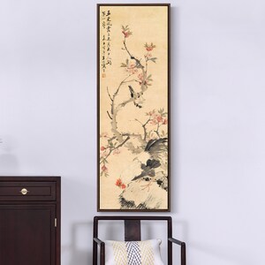 May include: A traditional Chinese painting on canvas depicting a rooster and two birds perched on a flowering branch. The painting is framed in a dark wood frame.