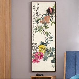 May include: A vertical painting depicting a branch with pomegranates and chrysanthemums. The painting is executed in a traditional Chinese style using brushstrokes in black, red, yellow, and green. The text in the painting reads "佛心自度", which translates to "Buddha's heart is self-sufficient".