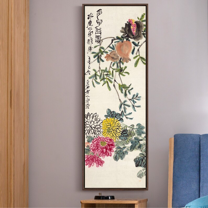 May include: A vertical painting depicting a branch with pomegranates and chrysanthemums. The painting is executed in a traditional Chinese style using brushstrokes in black, red, yellow, and green. The text in the painting reads "佛心自度", which translates to "Buddha's heart is self-sufficient".