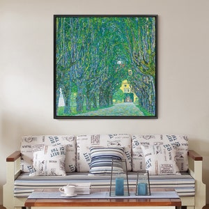 May include: A framed painting of a tree-lined path leading to a building. The trees are green and the path is a light gray. The building is yellow with a red roof.