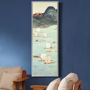 May include: A framed painting depicting a mountain range in the background with a light blue sky and a light blue body of water in the foreground.  The water is filled with small white sailboats with people in them.