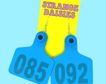 Cow Tag Earrings - Random Numbers - Novelty Large Bold Statement Funny Jewellery Big Weird Quirky Blue