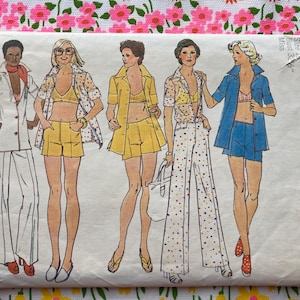 May include: A Simplicity sewing pattern envelope, number 6411, featuring illustrations of five outfits for a 32.5 inch bust. The designs include various combinations of collared shirts, shorts, and wide-leg trousers in white, yellow, and polka-dot prints.