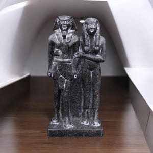 Replica of the Menkaure statue of an Egyptian monarch and couple Made by hand Egyptian artifacts in the form of granite statues Mythology