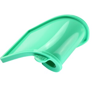 May include: A green silicone baking mold shaped like a curved rectangle. The mold has a raised edge and the word "Refloxy" is printed on the side.