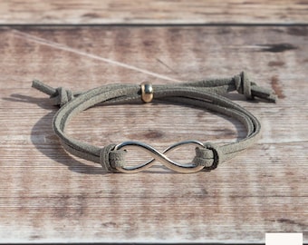 Neutrale verstelbare oneindigheidsbedelarmband van imitatiesuède