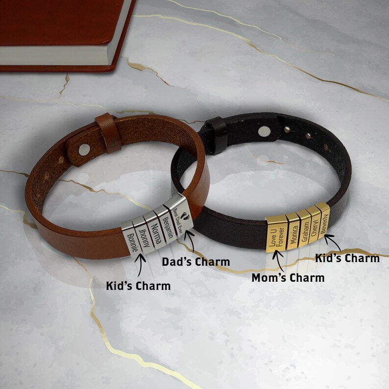 May include: Two leather bracelets with personalized charms. The brown bracelet has silver charms with the names Bonnie, Jhonny, Norma, Benjamin, and "Best Dad Ever". The black bracelet has gold charms with the words "Love U", "Forever", Monica, Graham, Cheryl, and Beverly.