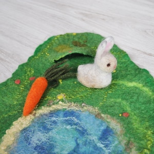 Spring meadow play mat with bunny and carrot. Happy Easter kids gift