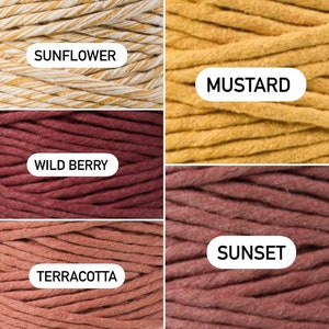 May include: Four spools of cotton rope in different colors: sunflower, mustard, wild berry, and terracotta. The spools are labeled with their respective colors.