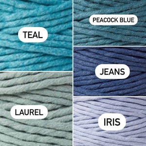 May include: Five spools of cotton cord in different shades of blue and green. The colors are Teal, Peacock Blue, Jeans, Laurel, and Iris.