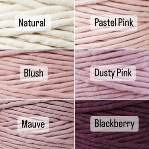 May include: Six spools of cotton cord in various shades of pink, from natural white to deep purple. The colors are labeled "Natural", "Pastel Pink", "Blush", "Dusty Pink", "Mauve", and "Blackberry".