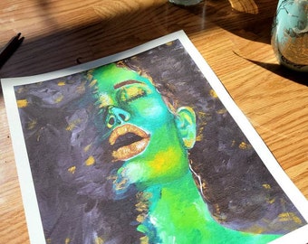May include: A painting of a person's face with green skin and gold lips. The background is black with gold flecks.