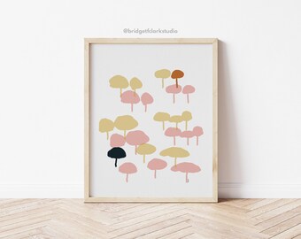 May include: Abstract art print featuring a cluster of pink, yellow, and orange mushroom-shaped forms on a white background. The print is framed in a light wood frame.